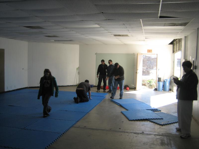 Laying the floor at our new school.